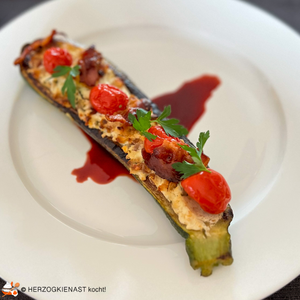 1 half zucchini with date-goat cheese filling, on port wine caramel topped with bacon